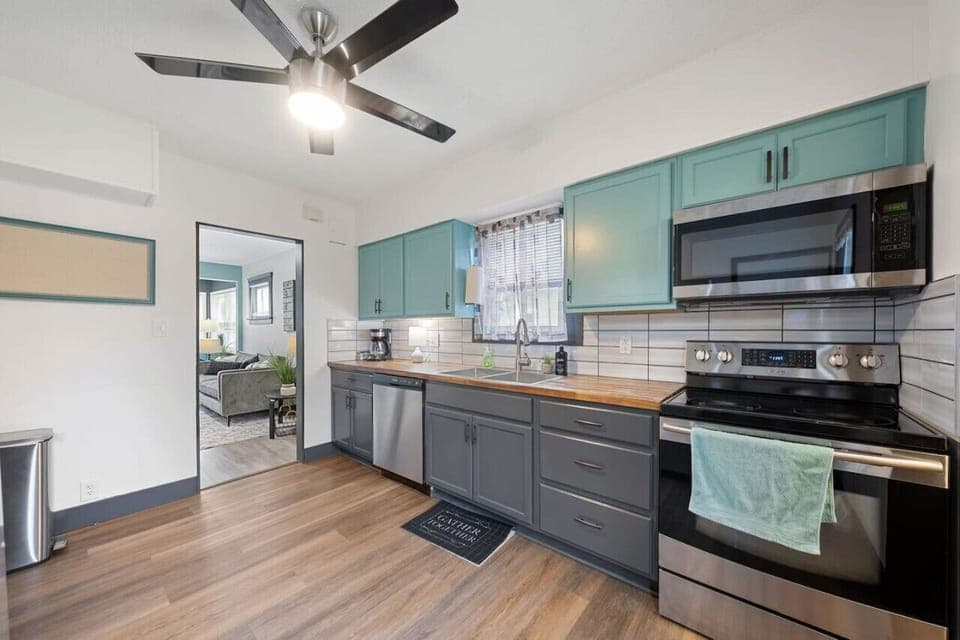 Bright, modern kitchen with everything you need — from coffee to cookware — plus bar seating for two.