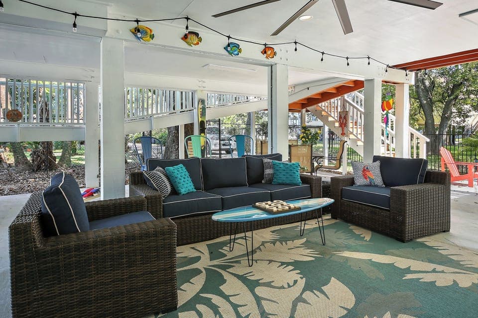 WOW!   Check out this great outdoor space, fully shaded with big screen TV, ceiling fan, and bar area!   So much fun to be had in and around this lovely property.  The owners really went all out.