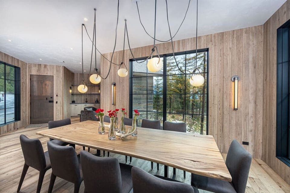 The custom light fixture is a beautiful focal point of the dining area.