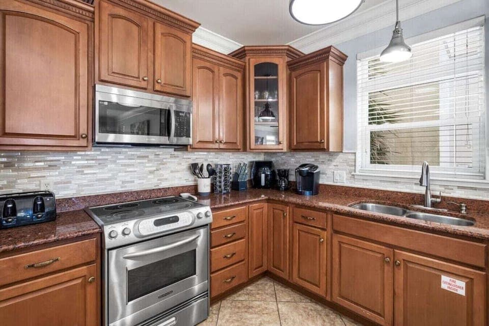 Your fully equipped kitchen awaits with granite counters, stainless appliances, and everything needed to create memorable meals during your stay.