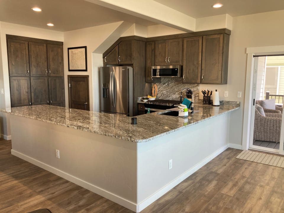 Kitchen. Large granite counter top. with chiseled live edge..
