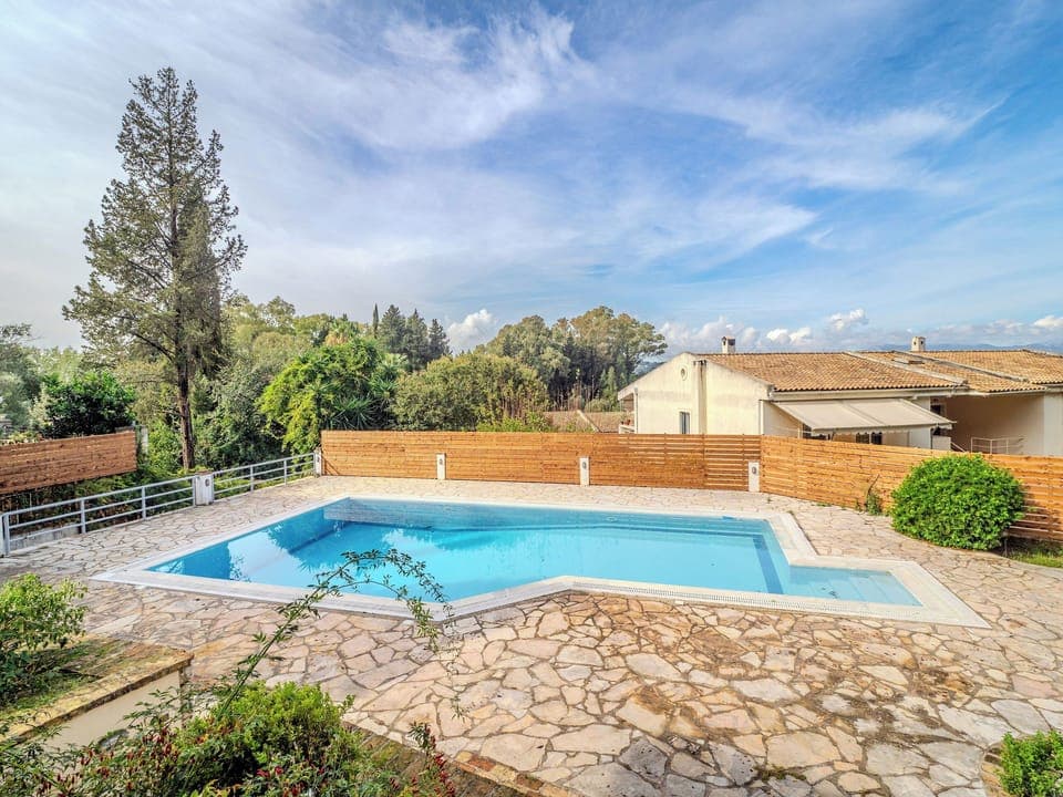 "Savor the tranquility of our outdoor oasis, where the soothing sounds of nature accompany every dip in the pool."