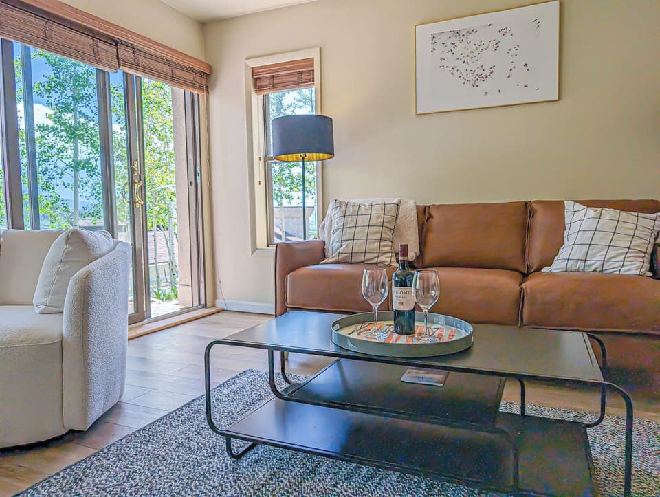 [1st Flr Living Room] The comfy couch opens up to a queen-sized bed