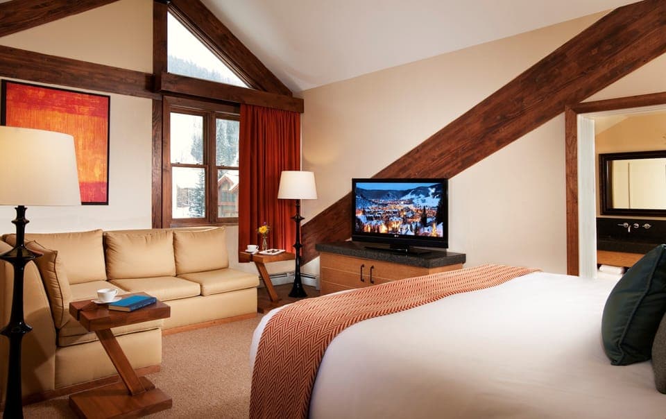 Kick up your feet and relax in the cozy Deluxe Room.