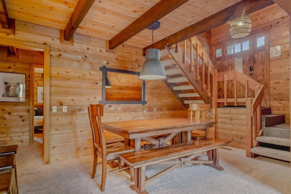 Dining Room: 9-person dining table, adjacent to kitchen and living room