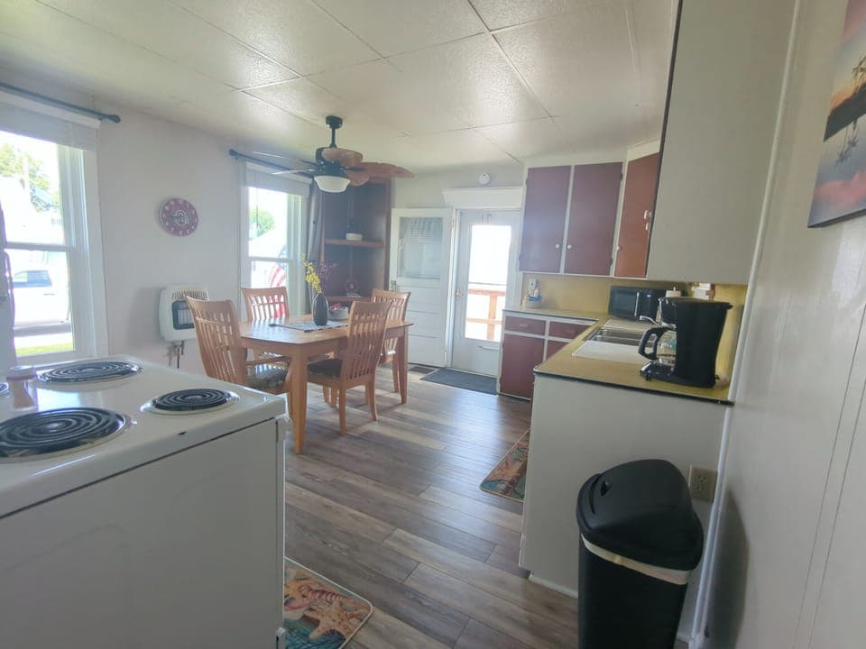 Rustic, country kitchen complete with all the pots and pans you'll need to whip up a quick meal to enjoy.