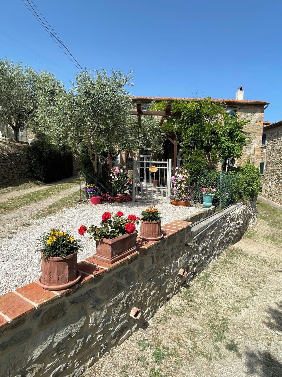 Front of house with attached parking for a compact.  Additional parking provided