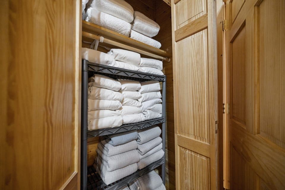 Linens for every bed are provided in the larger bunkroom closet.