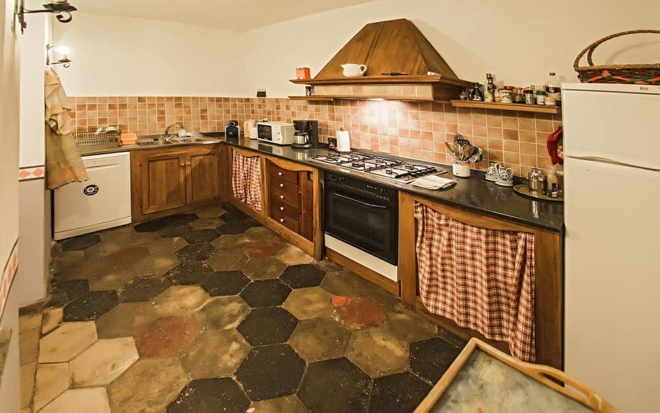 Countertop, Cabinetry, Property, Kitchen, Kitchen Stove, Wood, Lighting, Interior Design, Flooring, Floor