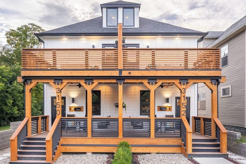 Custom front façade with two-story terrace. Guests have access to both sides of the duplex.
