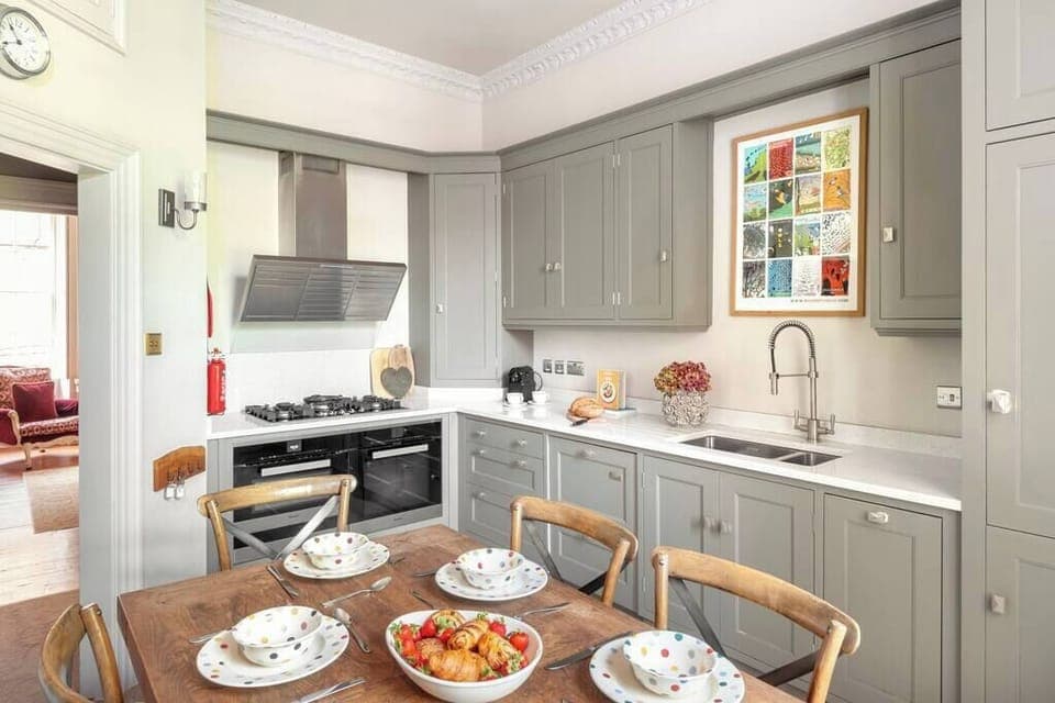 The open-plan kitchen/ dining room is fully-equipped with everything you will need for your stay. 