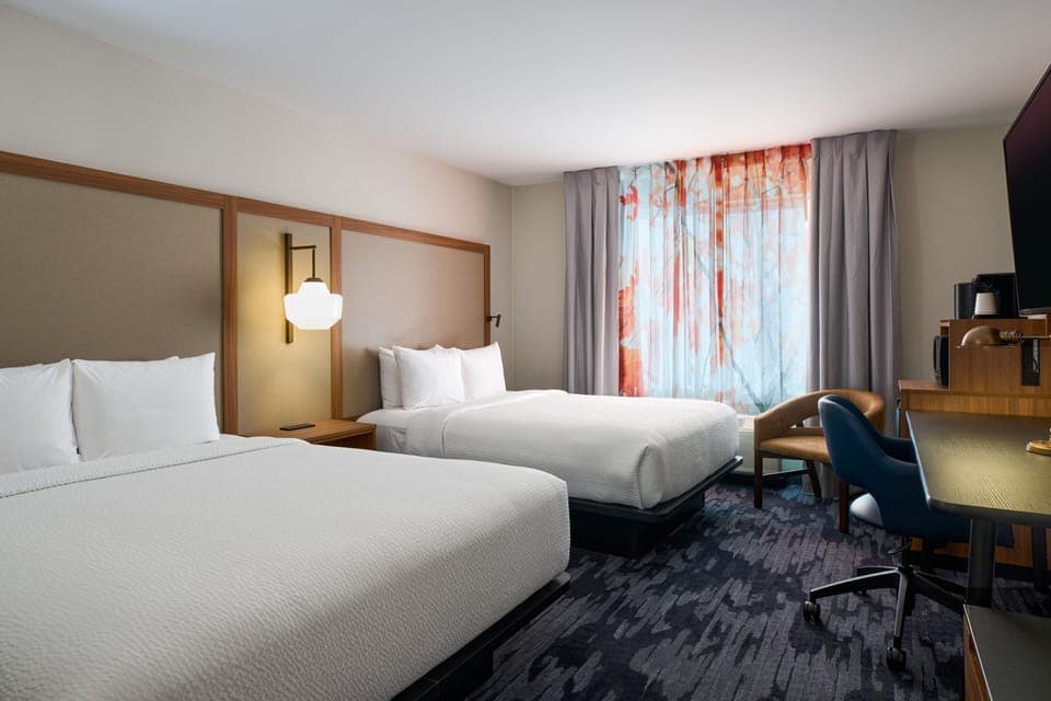 Select Comfort beds, desk, laptop workspace, blackout drapes