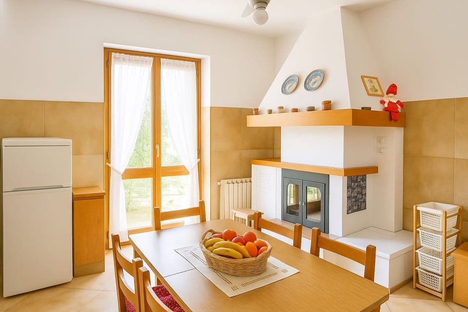 Kitchen with fireplace and French door to access garden
