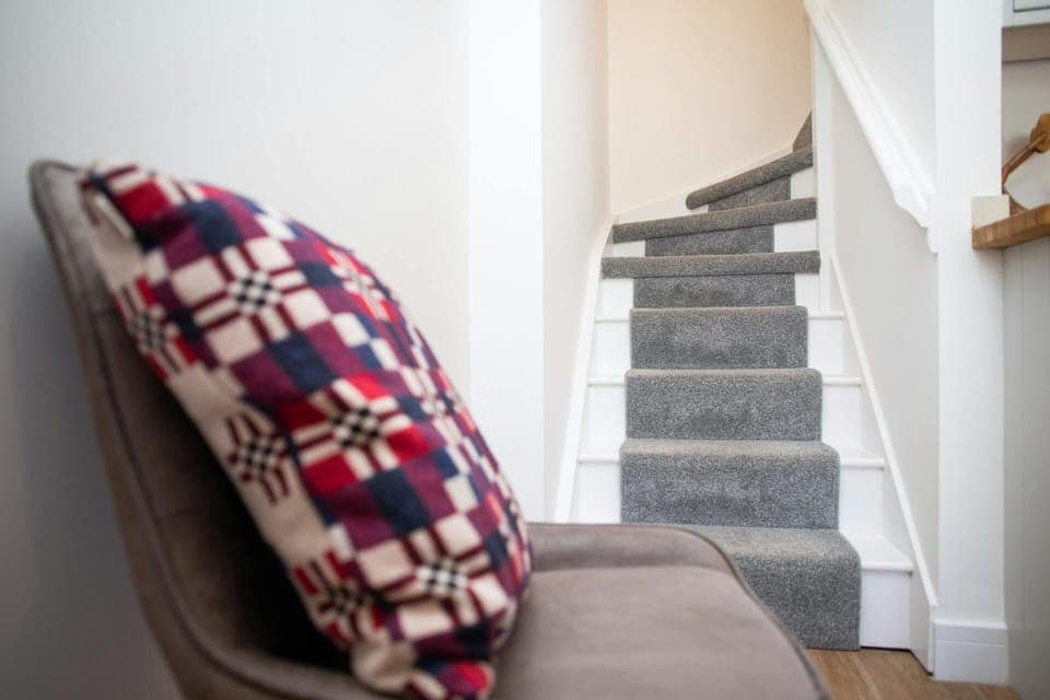 Stairs leading from the hall to the first floor