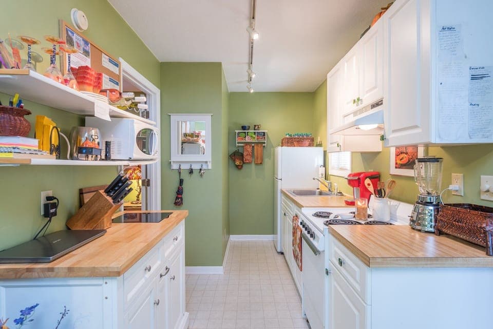 Adorable kitchen at Uptown Treehouse. Note: The Keurig pictured is no longer at the home & has been replaced by a standard Drip-Style coffeemaker. There is no dishwasher.