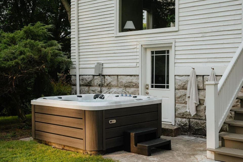 Unwind in the outdoor hot tub, the perfect spot to relax after a day of exploring.