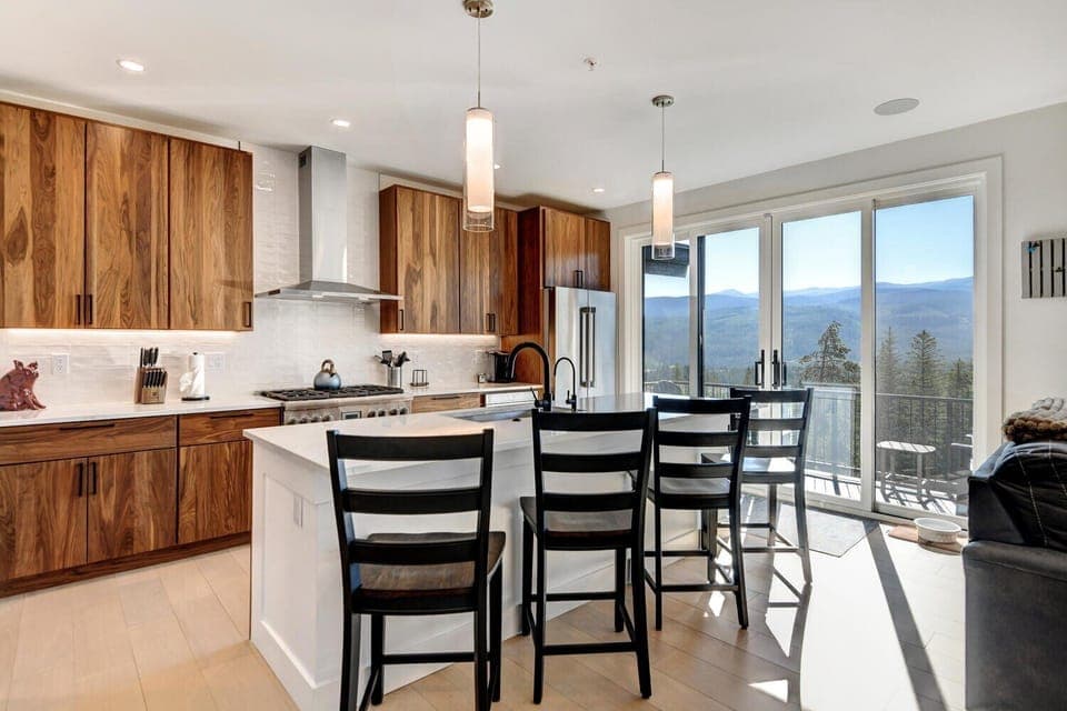 Fully Stocked Chefs Kitchen With An Oversized Island That Includes Bar Seating For 4 People