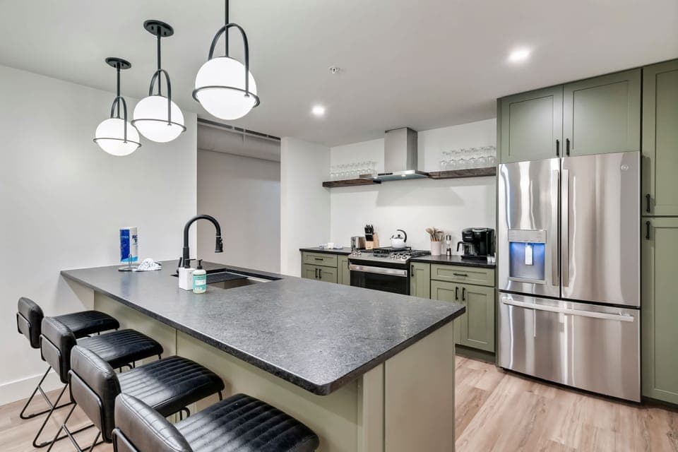Modern style meets function with sleek finishes and ample seating for culinary adventures!