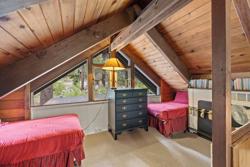 Loft with books and twin beds