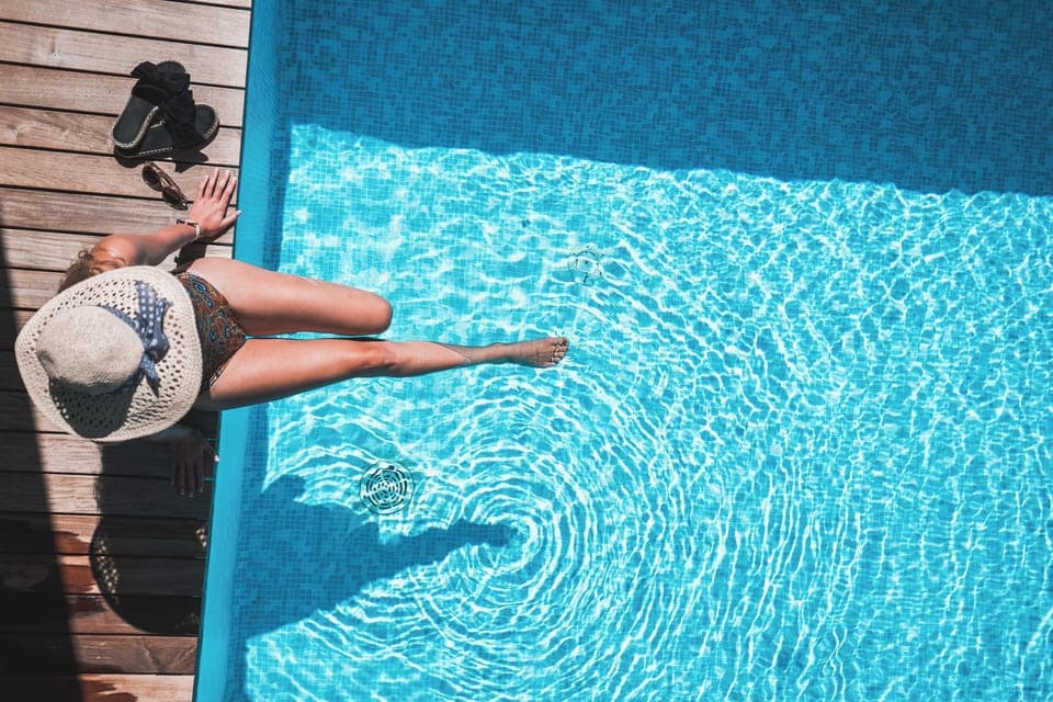 Seasonal outdoor pool, open 7:30 AM to 7:00 PM, pool umbrellas