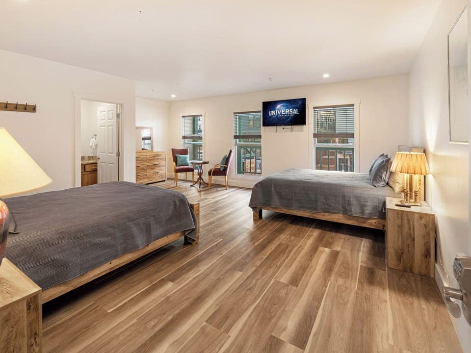 The China Pearl Suite has two queen beds, private full bathroom and Smart TV. 