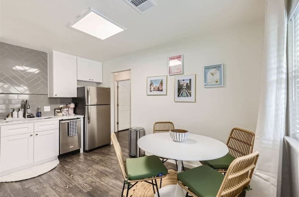 5. Open kitchen and dining area designed for both style and functionality. The modern kitchen features sleek appliances and ample counter space, while the dining area offers a perfect spot for family meals or entertaining. 