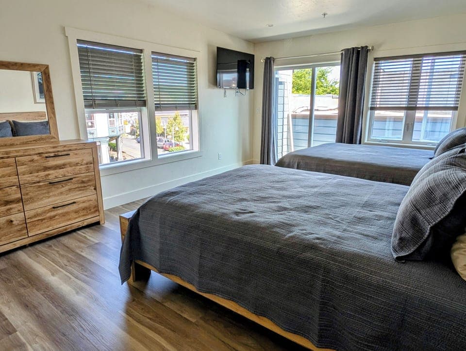 Herbs Room has two queen beds, Smart TV, porch and private bathroom.