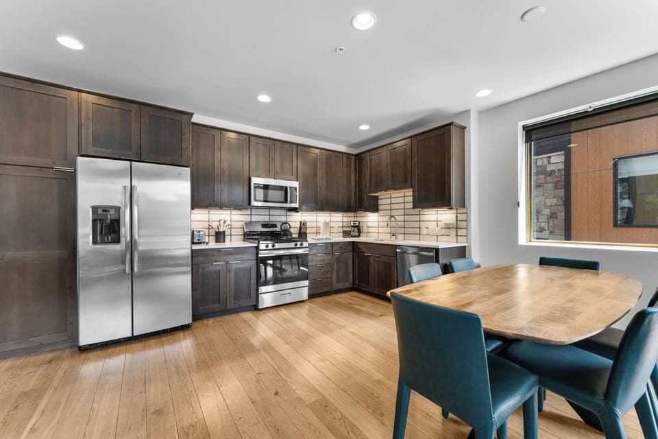 Full updated kitchen with stainless steel appliances.