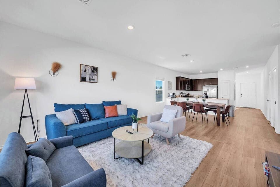 Modern, cozy open-concept home with stylish decor, comfy seating, a full kitchen, and dining for six. Enjoy natural light, Wi-Fi, and a peaceful setting—perfect for relaxing, working, or exploring nearby attractions.