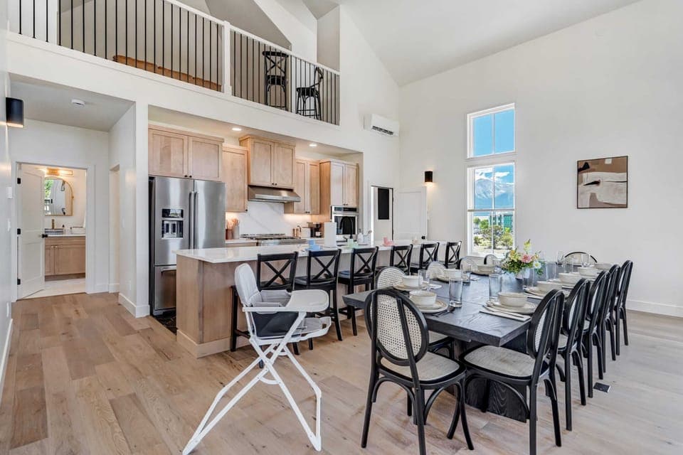 Elegant open-plan living and dining area with high ceilings and ample natural light.