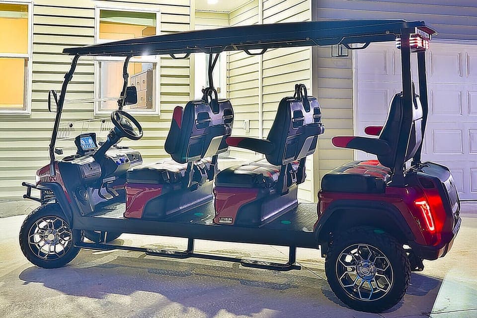 Six-seater golf cart available for your use.