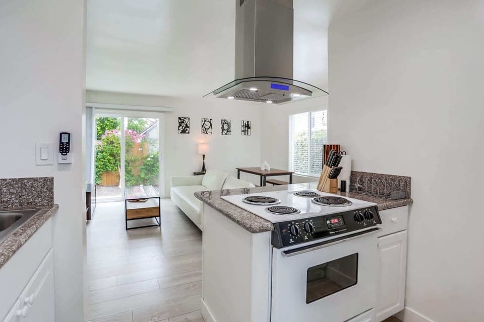 Oven has been updated with an open view into the living room