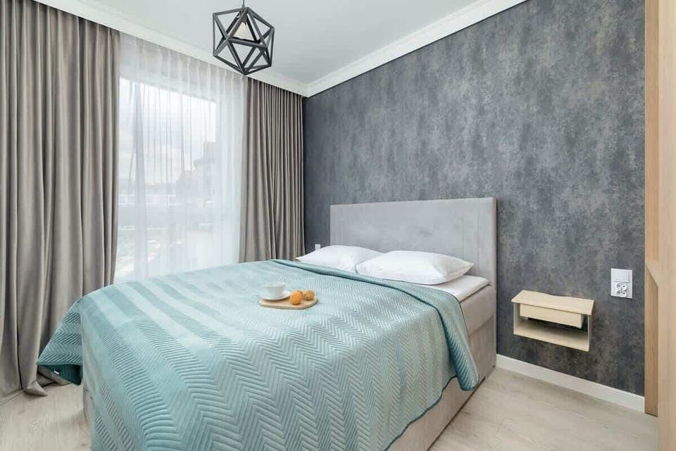 Bedroom with a double bed and a spacious wardrobe.