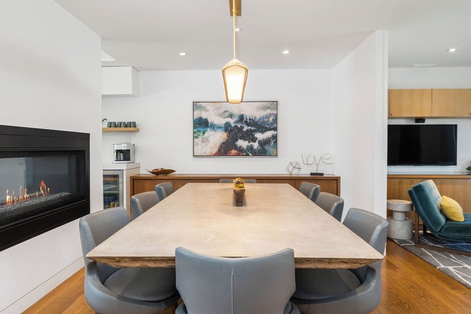 Bose surround sound and a cozy fireplace create an inviting dining space.