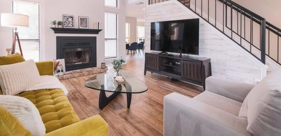 The living room features a large 70" smart TV. You'll love family movie nights here. Just pop come popcorn and curl up with a blanket for a great indoor night.