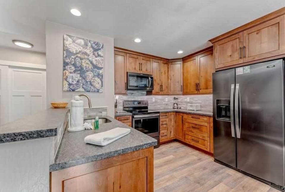 Kitchen: Well-equipped kitchen, updated appliances, open layout to dining and living room