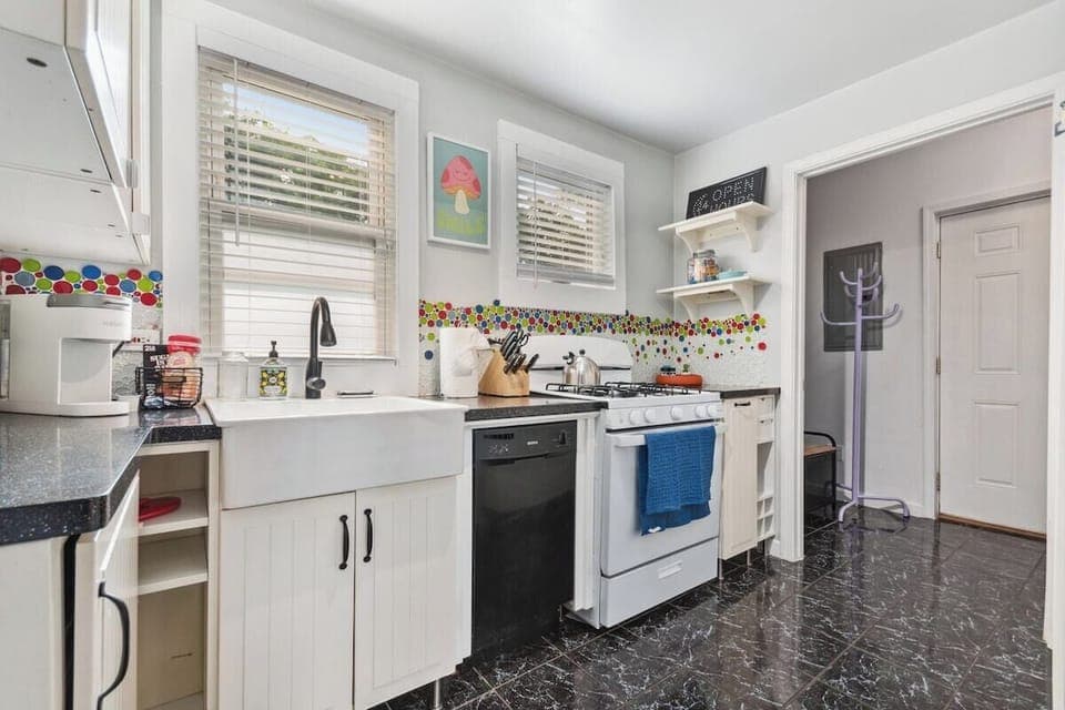 Beautiful, sunny fully stocked kitchen.