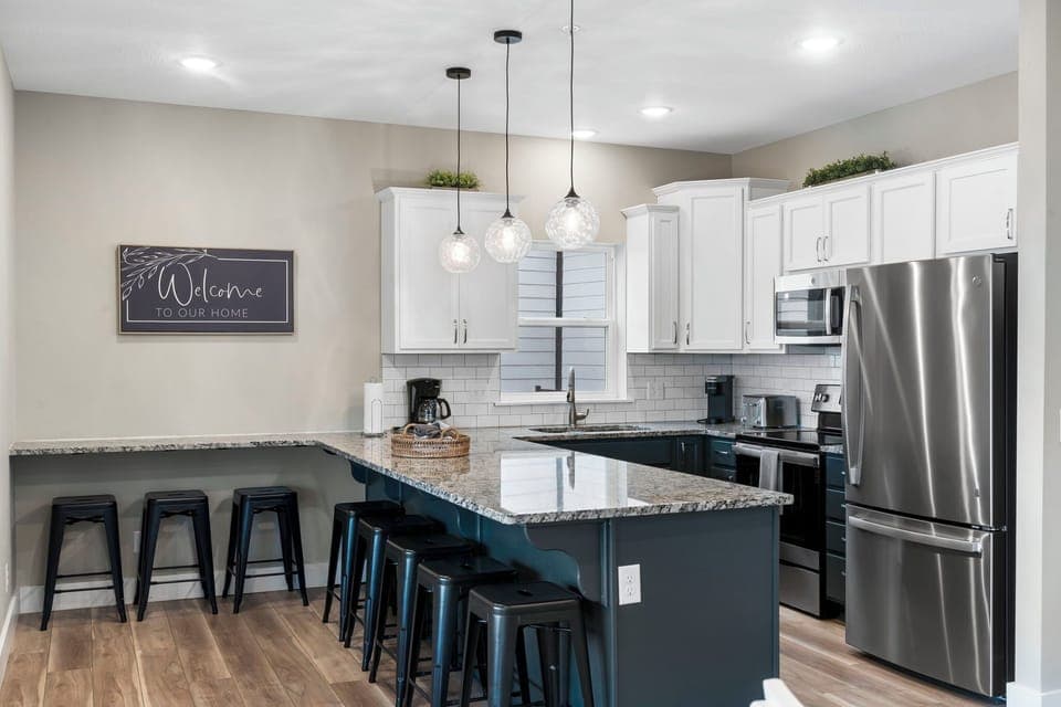 Fully Equipped Kitchen with Upgraded Appliances and Extra Bar Seating