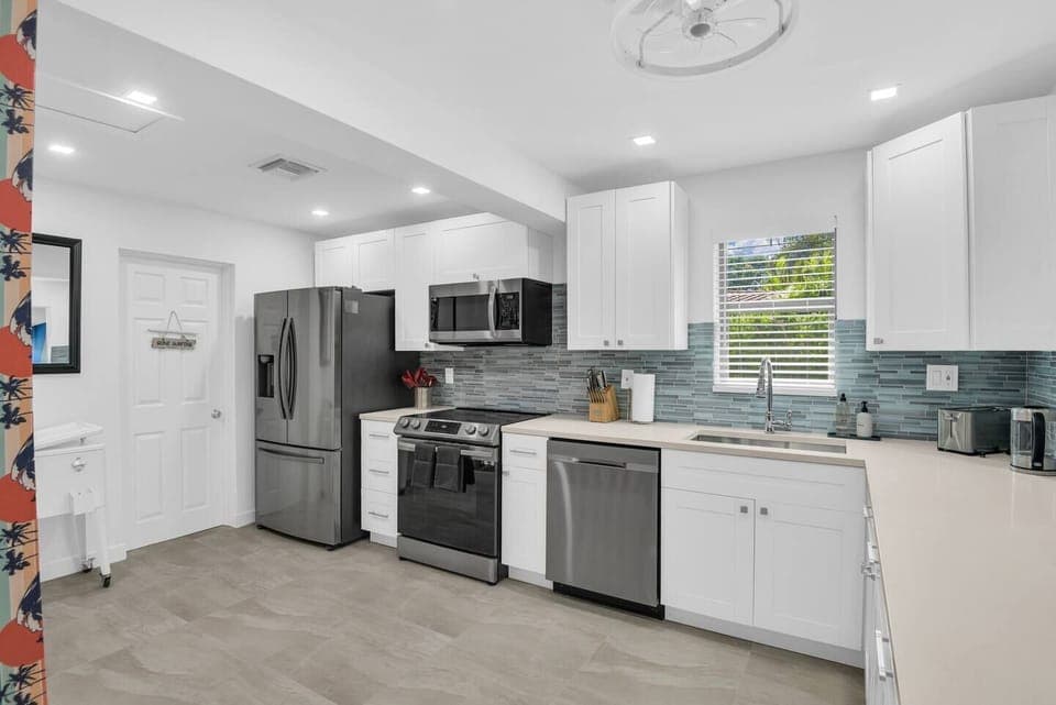 This kitchen is ready for anything, with a full suite of high-end appliances, cookware, and utensils, making it perfect for both casual meals and gourmet cooking.