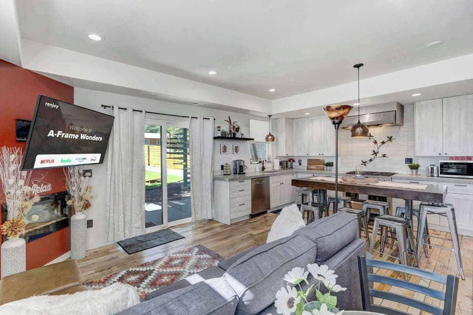 Unwind in this bright and stylish living area, where modern comforts meet cozy charm.