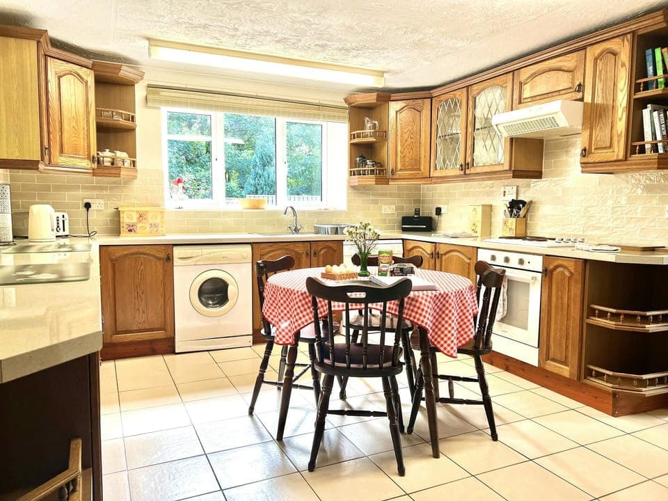 Kitchen with dining table and chairs