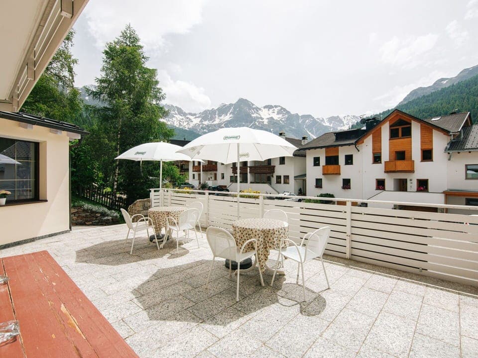 Sky, Cloud, Furniture, Property, Building, Table, Window, Flowerpot, Outdoor Furniture, Umbrella