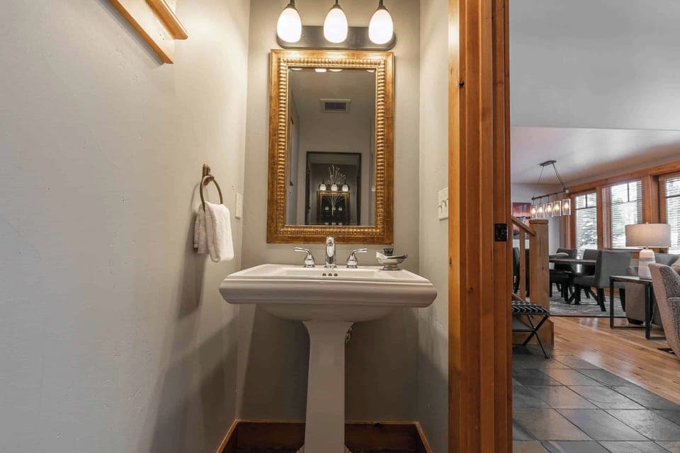 Guest powder room is featured downstairs, as well.