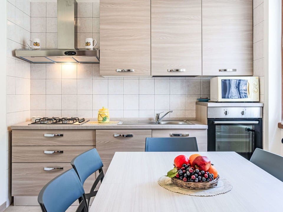 Cabinetry, Furniture, Property, Countertop, Table, Kitchen Stove, Sink, Kitchen Appliance, Interior Design, Kitchen