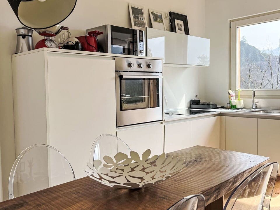 Furniture, Interior Design, Kitchen Appliance, Kitchen, Countertop, Flooring, Wood, Cabinetry, Major Appliance, Home Appliance