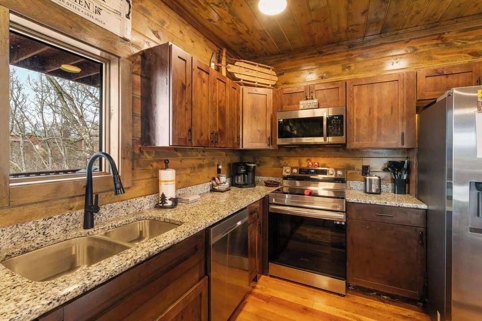 The inviting, open kitchen offers ample space & all the comforts of home