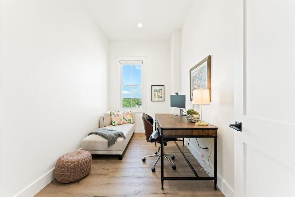 2nd Floor: Private office with monitor and chaise, blackout shade