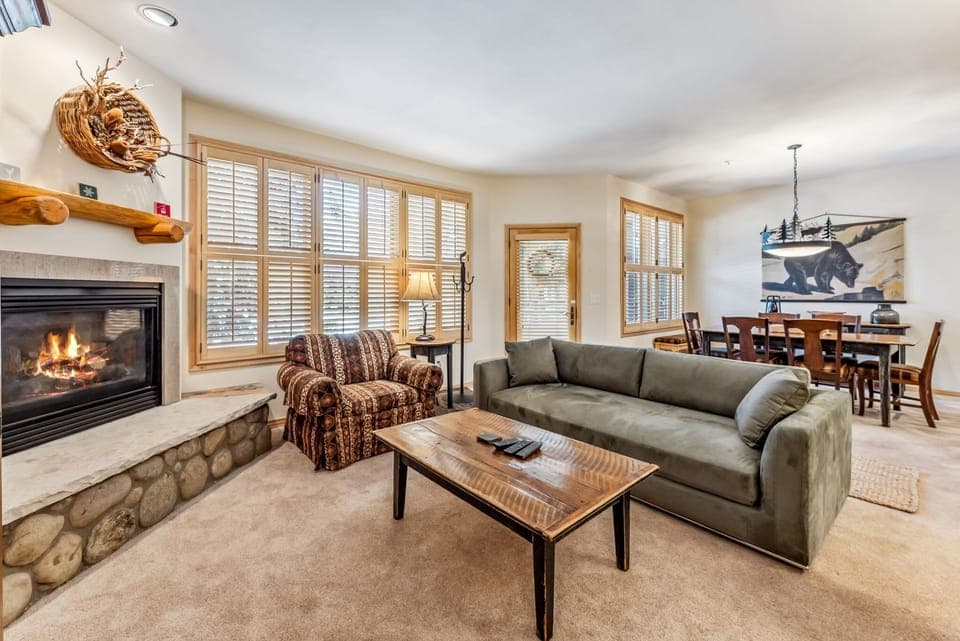 Living Room: 2 couches, 1 pull-out bed, oversized chair, gas fireplace, 39” TV
