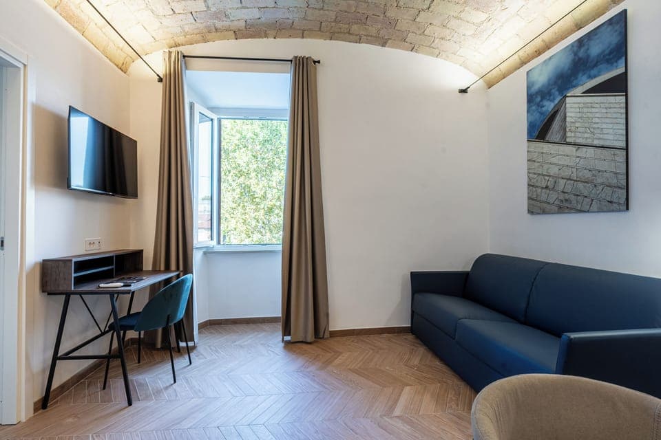 Family Studio, City View | Minibar, in-room safe, desk, laptop workspace