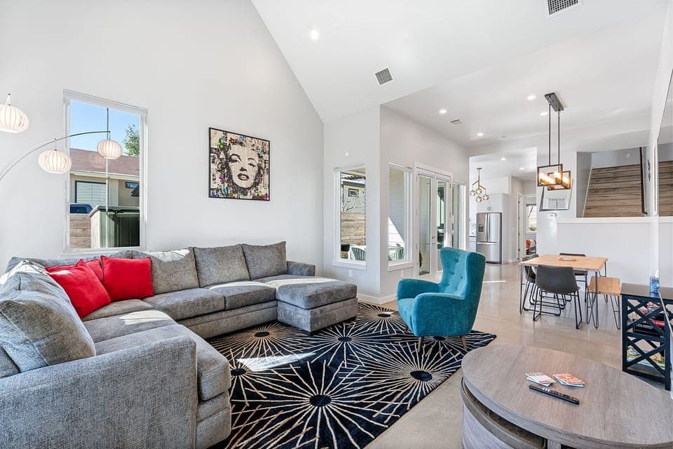 Curl up in the chic, open living room & enjoy a movie night at home